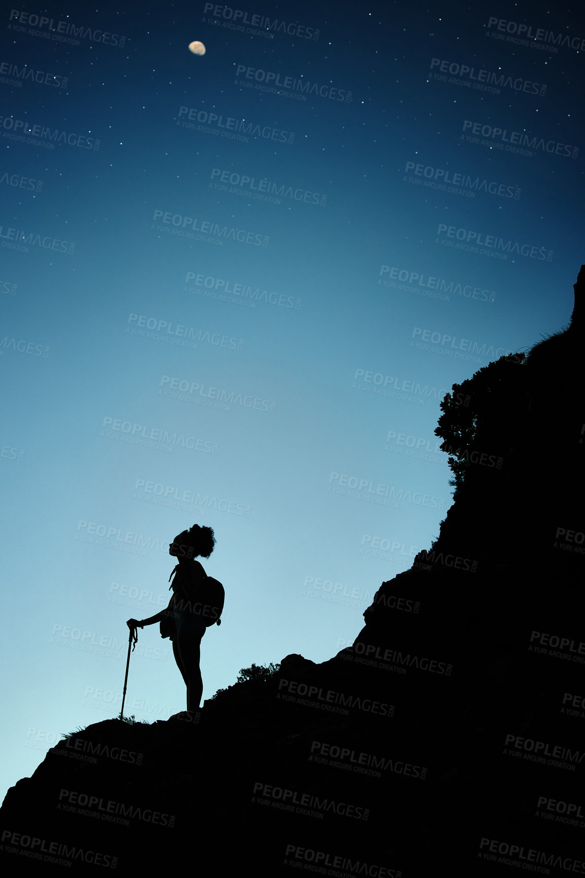 Buy stock photo Person, silhouette and hiking at night with trekking stick for explore mountain, adventure or challenge. Hill, rocks and climber workout for early morning cardio as athlete in forest, fit or dark