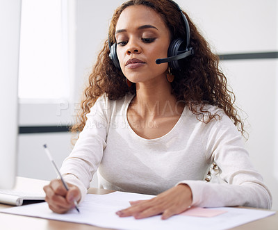 Buy stock photo Call center, serious woman and writing notes for support, customer service and CRM consulting in office. Focused female agent, consultant and documents for telemarketing, administration and web sales