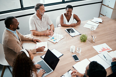 Buy stock photo Shot of a group of businesspeople having a meeting at work