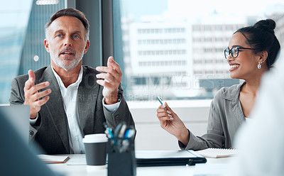 Buy stock photo Shot of a group of businesspeople having a meeting in an office