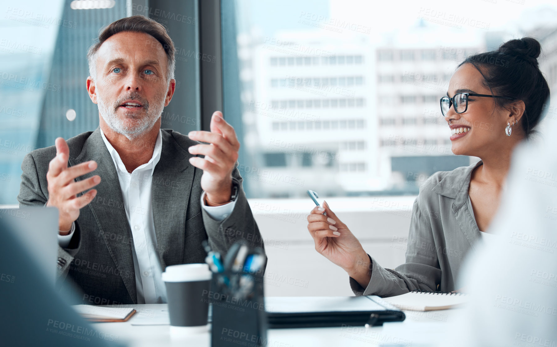 Buy stock photo Shot of a group of businesspeople having a meeting in an office