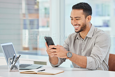 Buy stock photo Shot of a young businessman using his cellphone to send a message