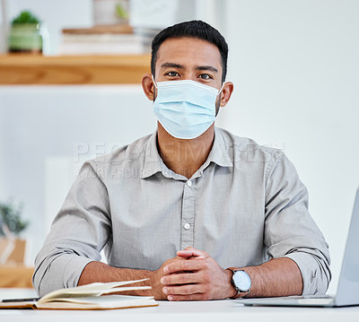 Buy stock photo Portrait, mask and man with laptop, office and working in agency, media and researcher with cloth for safety. Workplace, computer and notebook of employees, protection and prevention of virus in job