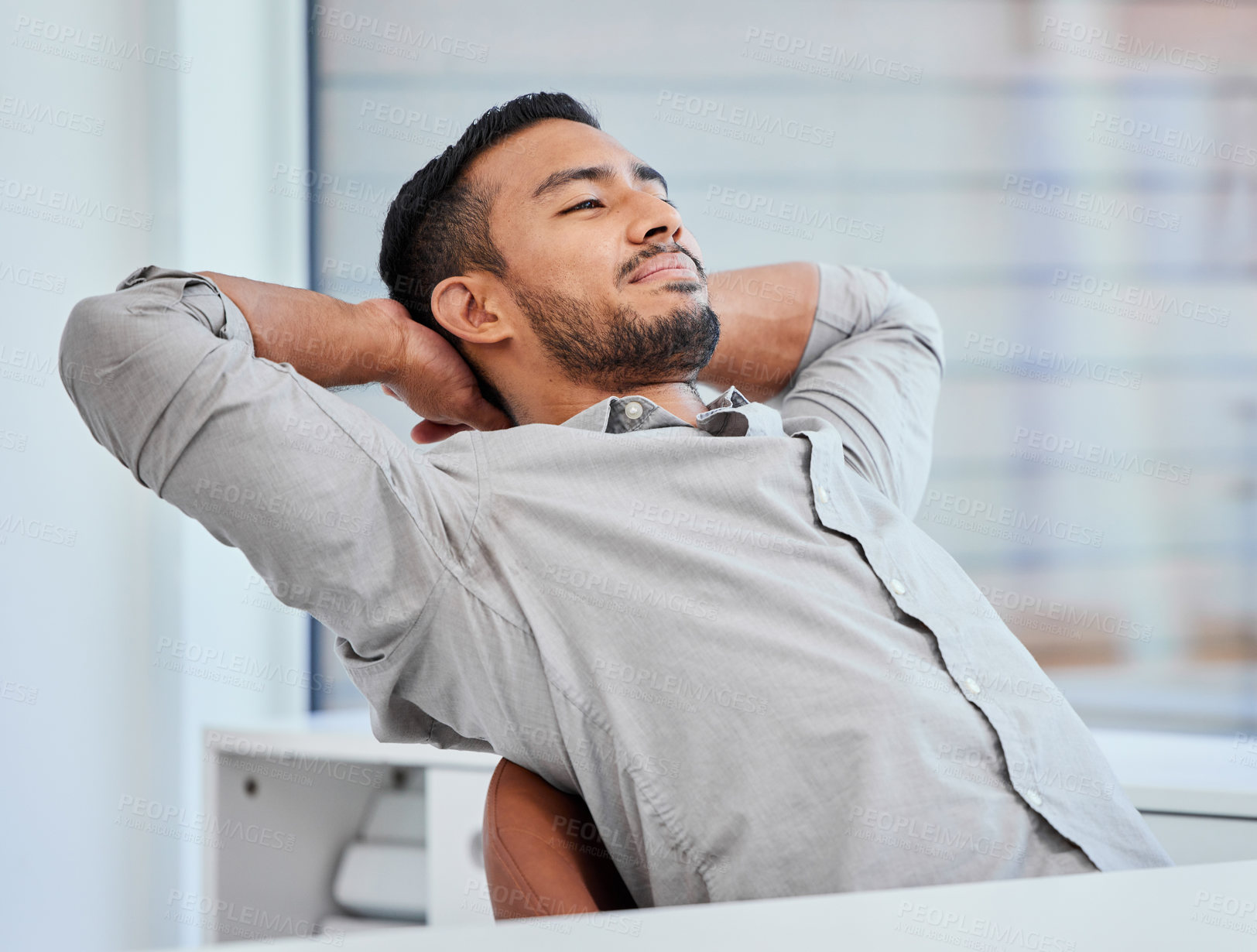 Buy stock photo Shot of a young businessman taking a satisfied break