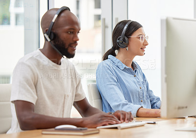Buy stock photo Shot of two call center workers together