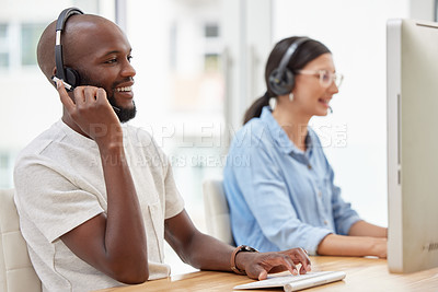 Buy stock photo Shot of two call center workers together