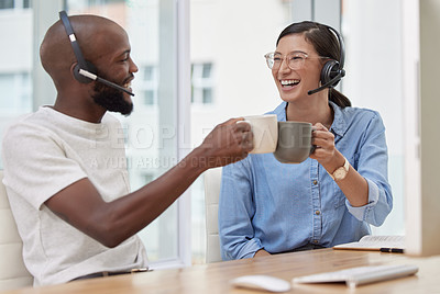 Buy stock photo Man, woman and call centre colleagues with cheers, coffee and celebration at desk in office. Customer service, contact us and crm agents at workplace, teamwork and help or support for happy employees