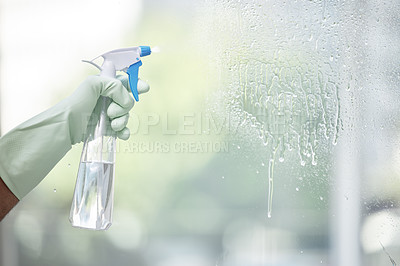 Buy stock photo Shot of an unrecognizable person cleaning a glass window at home
