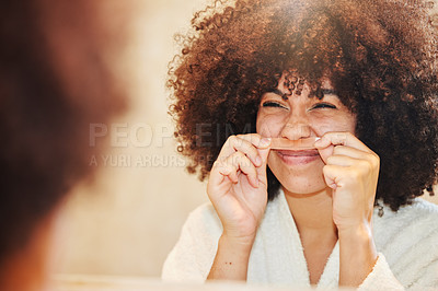 Buy stock photo Shot of a young woman using a wax strip on her upper lip