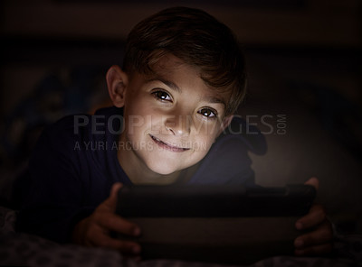 Buy stock photo Tablet, portrait and boy child at night watch movie, film or show online for entertainment at home. Relax, dark and young kid streaming video on internet with digital technology in bedroom at house.