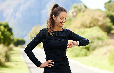 Buy stock photo Outdoor, smart watch and woman with fitness, exercise goals and progress with challenge, wellness and sunshine. Nature, person and runner with performance, smile and training with achievement or time