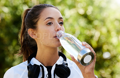 Buy stock photo Woman, headphones and bottle with water to drink, health or hydration for sports, training or workout. Outdoor, female person and athlete with vision after exercise for fitness, wellness and cardio