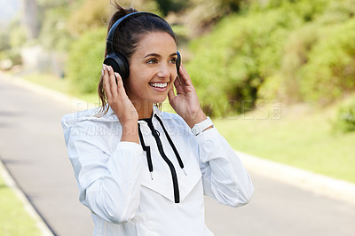 Buy stock photo Woman, headphones and smile outdoor for fitness, wellness and health or cardio on weekend. Personal trainer, headset and happiness with music by road for exercise or sports in morning pre workout