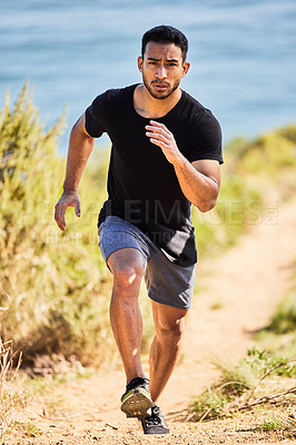 Buy stock photo Shot of a young man out for a run