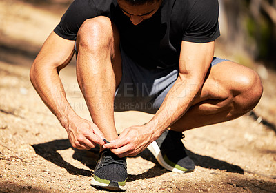 Buy stock photo Man, fitness and shoelaces for nature, workout and exercise with health and wellness. Runner, mountain trail and shoes for cardio, training for sport with feet for Australia marathon tying laces