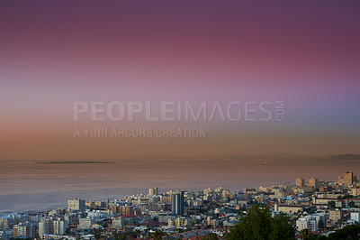 Buy stock photo Copy space sunset sky and city view of building infrastructure with sea or ocean background in abroad travel destination. Aerial of Cape Town downtown centre and urban cityscape architecture at night