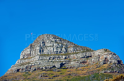 Buy stock photo Beautiful Lions Head mountain in Cape Town, South Africa on a relaxed bright sunny day out in nature. Close up detail of landscape view of rocky mountain and a blue sky with copy space during summer