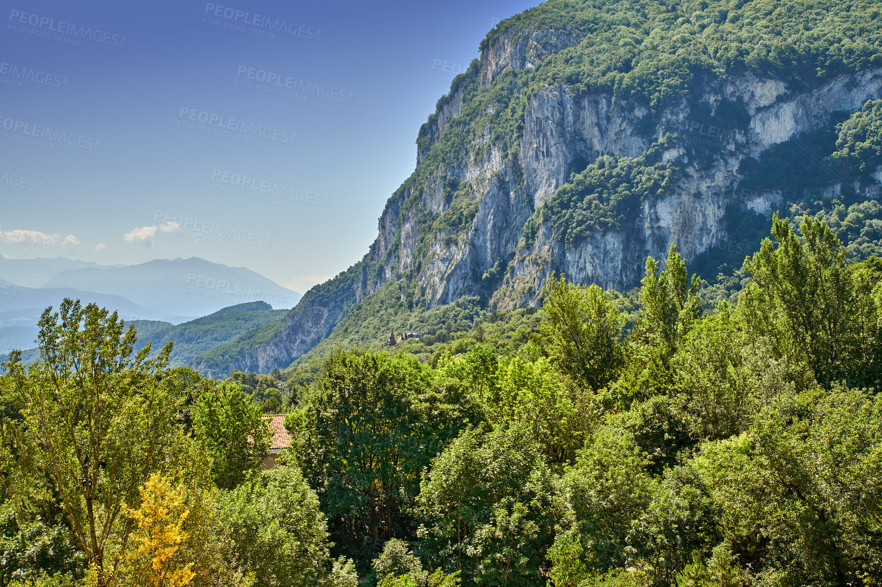 Buy stock photo Vibrant greenery with plants on a mountain in a secluded countryside. Peaceful scenic land of rolling hills. Green grass and bushes growing outdoors in nature on a hilly and mountainous landscape. 