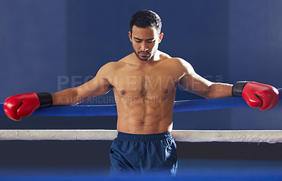 Buy stock photo Man, athlete and serious with gloves in ring for training, workout and practice for fighting competition. Boxing, pro champion and serious with sport for self defense, topless and healthy body in gym
