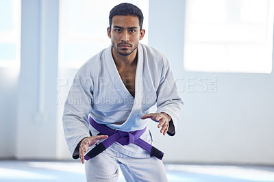 Buy stock photo Man, portrait and ready for karate sport in fitness center for self defense, fighting or discipline. Pro athlete, face and serious with martial arts for training, practice or wellness for competition