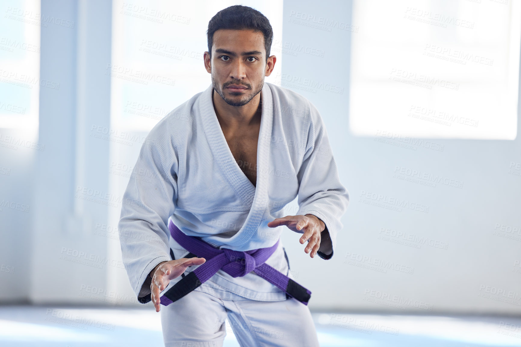 Buy stock photo Man, portrait and ready for karate sport in fitness center for self defense, fighting or discipline. Pro athlete, face and serious with martial arts for training, practice or wellness for competition