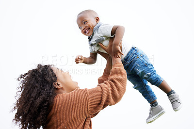 Buy stock photo Shot of a mother playing with her son outside