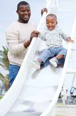 Buy stock photo Shot of a father and son playing in the park