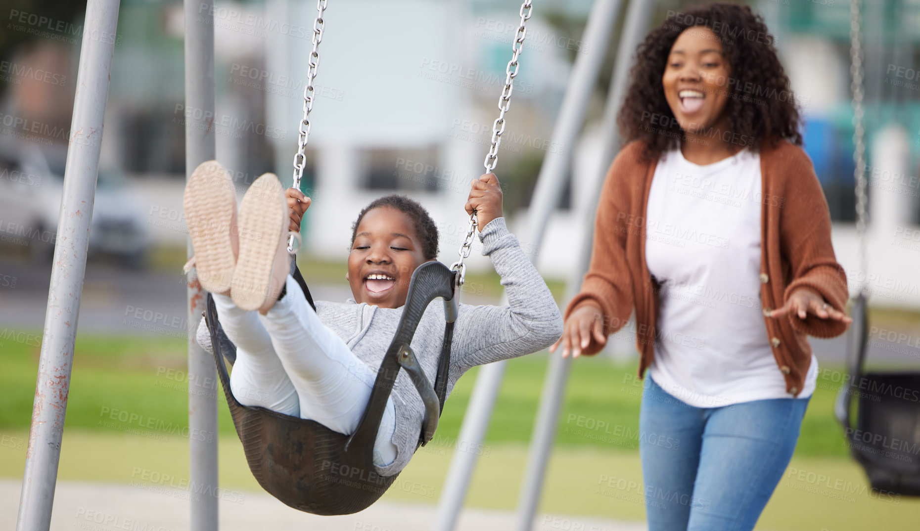 Buy stock photo Shot of a mother playing with her daughter outside