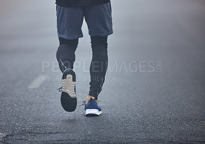 Buy stock photo Man, legs and running on road for fitness, exercise or cardio workout on asphalt in the outdoors. Leg of male person, athlete or runner on street for exercising, training or sports on mockup space