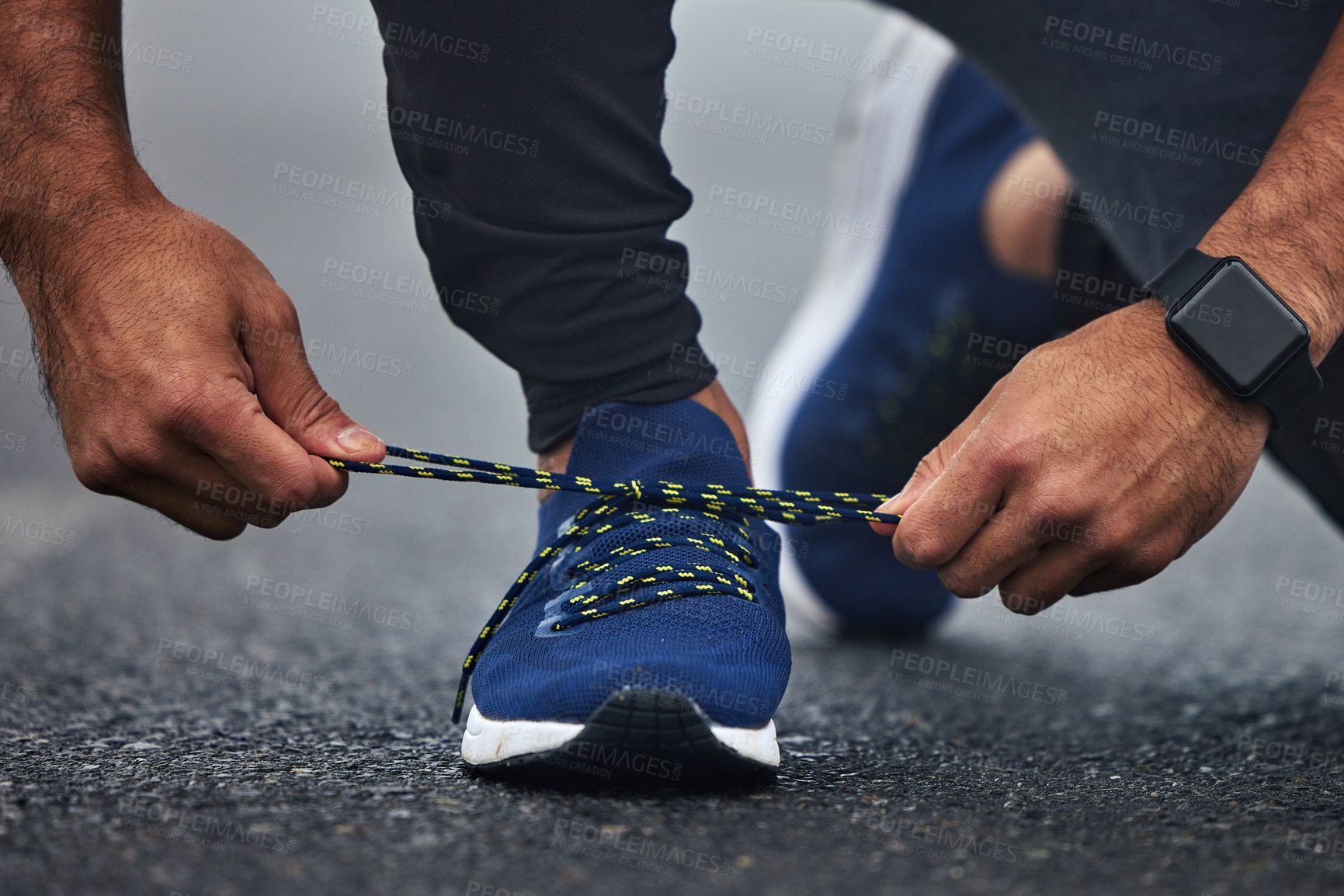 Buy stock photo Man, hands and tie shoes on road for running, fitness or cardio workout on asphalt in the outdoors. Hand of male person, runner or athlete tying shoe and getting ready for sports training on street