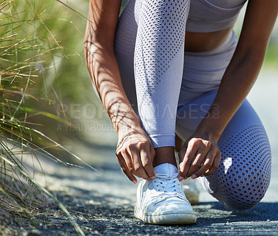 Buy stock photo Woman tying laces, shoes and hands, start run for fitness with cardio and health with active person outdoor. Female runner, healthy and active workout, ready for training and marathon race footwear