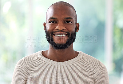 Buy stock photo Shot of a young man smiling at home