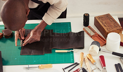 Buy stock photo Shoemaker, man and tool to cut leather with top view in workshop for creative skill, small business or craft. Professional, artisan and person win warehouse with material and equipment for diy design