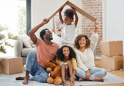 Buy stock photo Black family, floor and cardboard roof in home living room with game, laughing and bond with love. Father, mother and daughter with play, relax of box for sign of security in family house with smile
