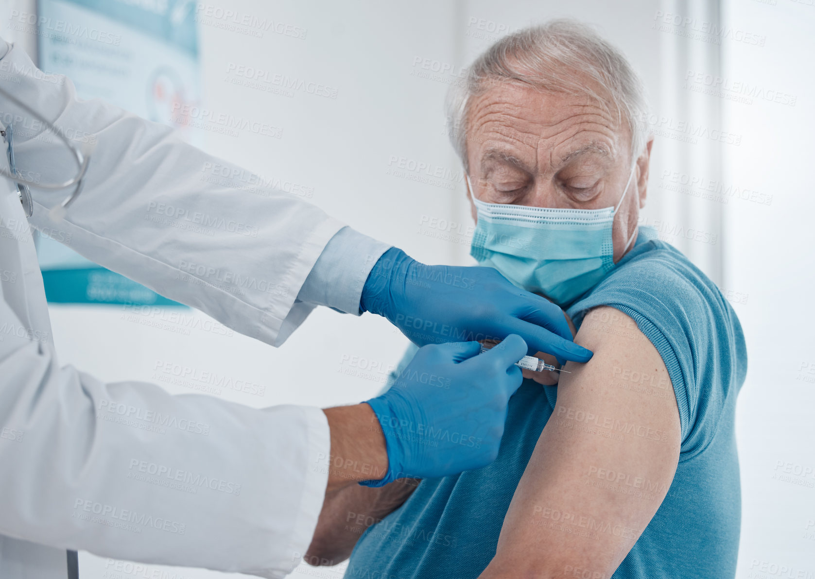 Buy stock photo Cropped shot of a handsome senior man getting his covid 19 vaccine