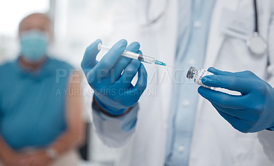 Buy stock photo Cropped shot of an unrecognizable male doctor preparing the covid 19 vaccination for a patient