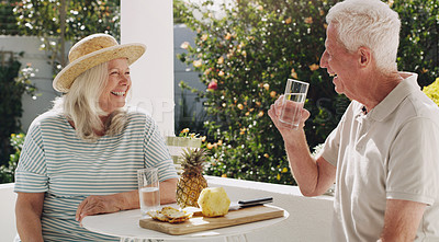 Buy stock photo Senior, couple or relax on patio with water for retirement, planning vacation for anniversary. Husband, wife or old in garden for talk with pineapple, sunshine in summer with partner in family home