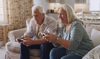 Buy stock photo Joystick, senior couple and technology for gaming, online streaming or leisure for happiness at home. Partners, elderly people and retirement with smile from esports, video game or challenge on sofa