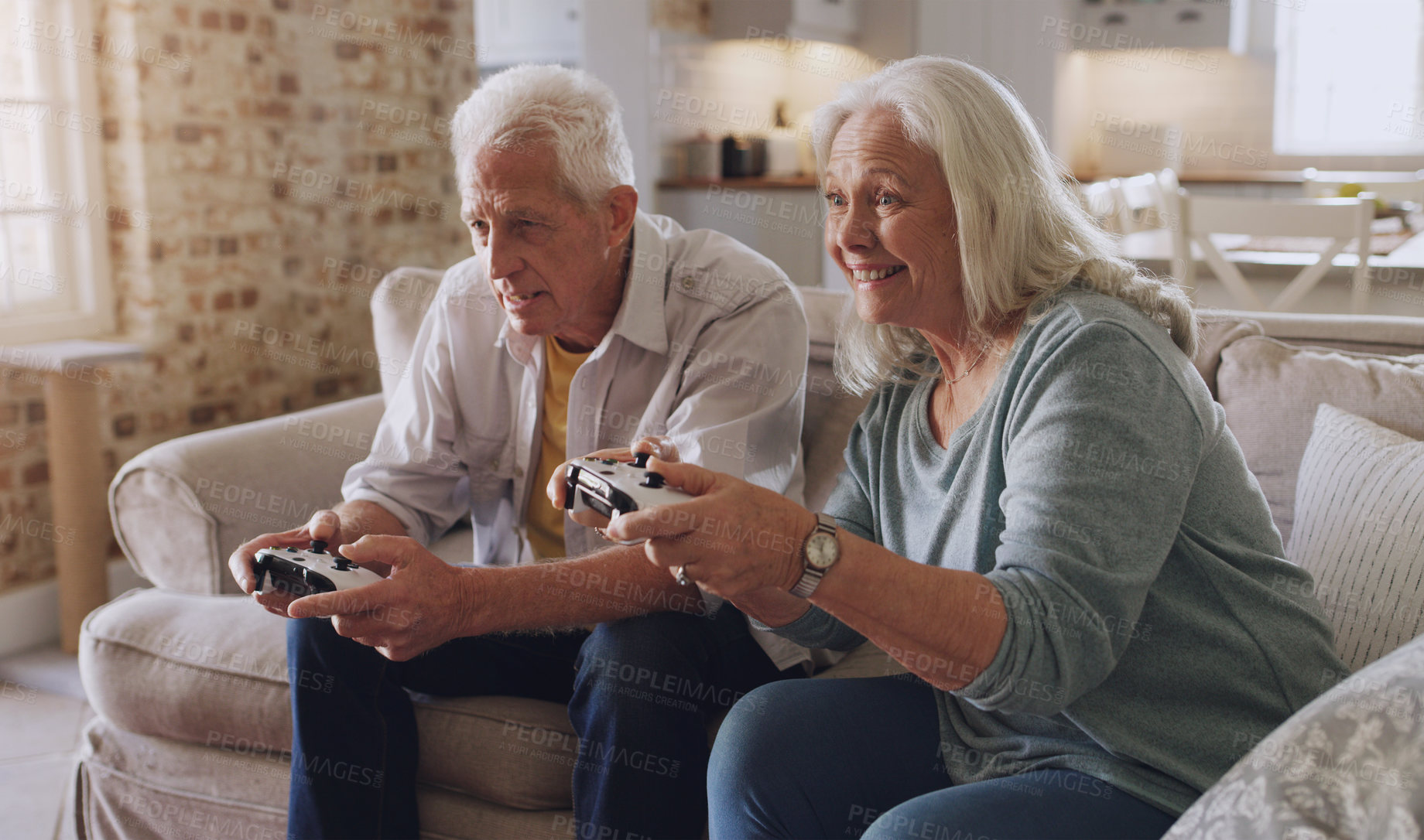 Buy stock photo Joystick, senior couple and technology for gaming, online streaming or leisure for happiness at home. Partners, elderly people and retirement with smile from esports, video game or challenge on sofa