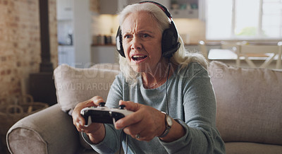 Buy stock photo Headphones, senior woman and controller for video game, online streaming and relax for retirement at home. Tech, elderly person and frustrated with joystick for esports, gaming and challenge on sofa