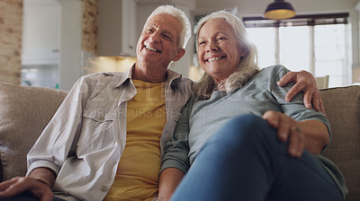 Buy stock photo Senior couple, happy and watching tv on sofa in house, home and living room in retirement together. Movie, elderly people and relax with smile on couch for comedy, live streaming and funny video