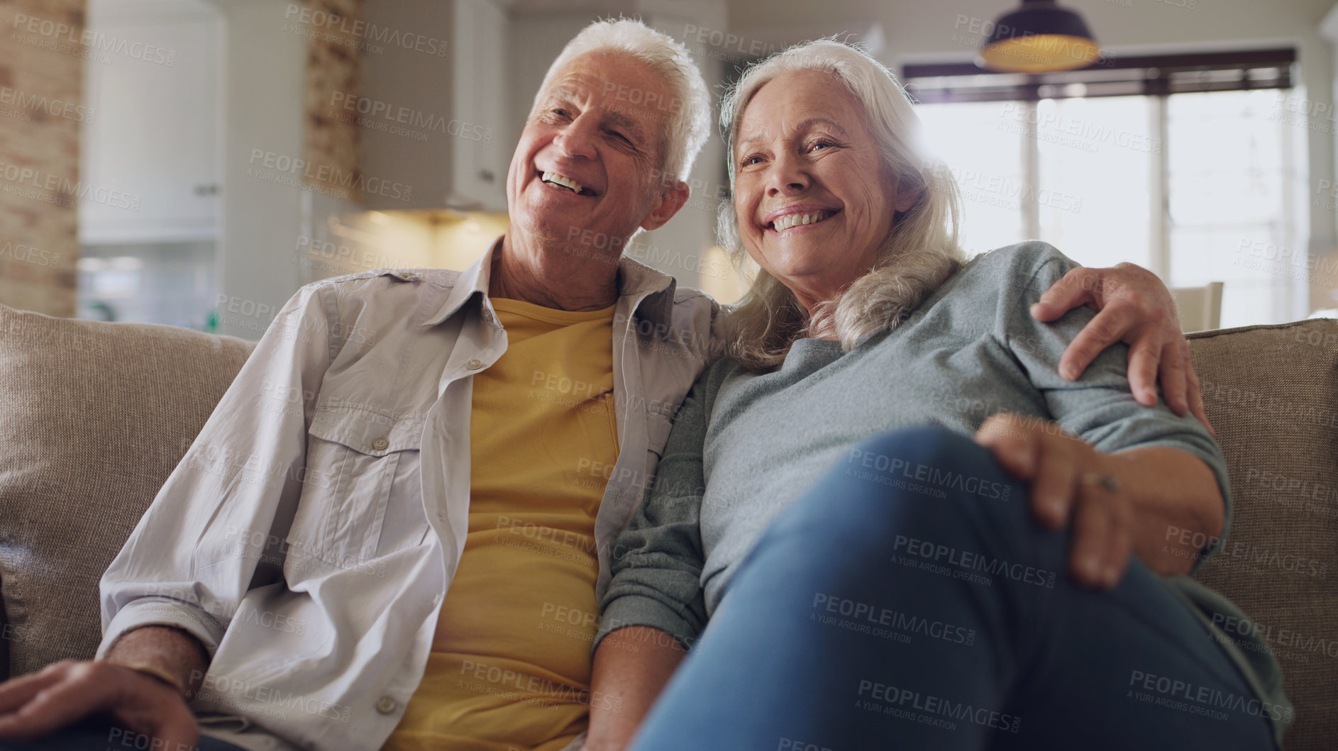 Buy stock photo Senior couple, happy and watching tv on sofa in house, home and living room in retirement together. Movie, elderly people and relax with smile on couch for comedy, live streaming and funny video