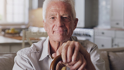 Buy stock photo Senior man, portrait and walking stick in house sitting on sofa for retirement, relax and comfort. Elderly person, happy and cane in home for peace, calm and pension while thinking about memories