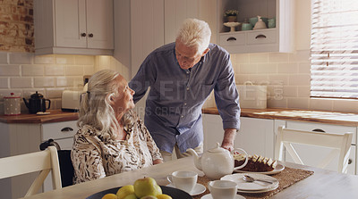 Buy stock photo Elderly, married couple and smile in kitchen for breakfast, morning or relax for retirement, love or support. Pensioners, talking and home for cake for relationship, joy and trust for happiness 