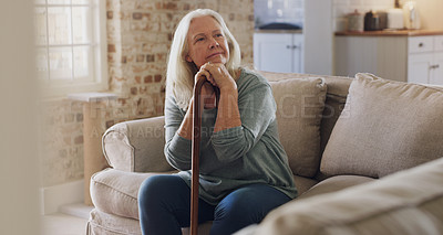 Buy stock photo Senior woman, thinking and walking stick for balance in home, recovery and memory or relax on sofa. Retirement, wonder and person with disability on couch, arthritis and cane for assistance or help