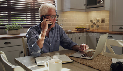 Buy stock photo Laptop, phone call and mature man in home with customer service consultation for online crm. Technology, cellphone and male technical support agent on mobile discussion with computer in kitchen.
