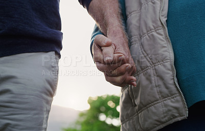 Buy stock photo Couple, people and holding hands in outdoor for walk, together and support in London. Relationship, date and bonding for romance with sunset for care, relax and happiness as soulmate for love
