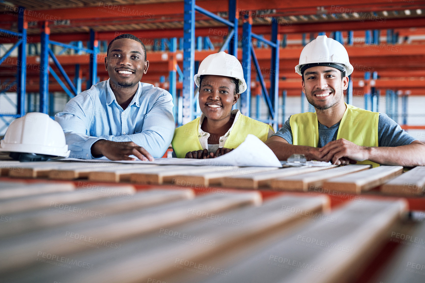 Buy stock photo Shot of a group of builders having a meeting at a construction site