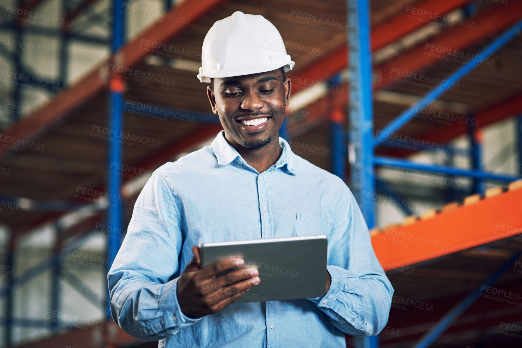 Buy stock photo Shot of a builder using a digital tablet while working at a construction site