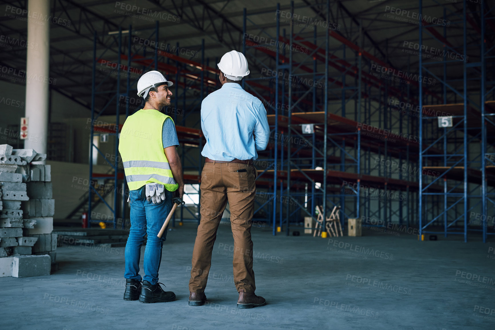 Buy stock photo Shot of two builders inspecting a construction site